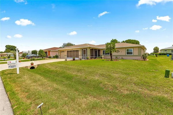 a view of a house with a yard