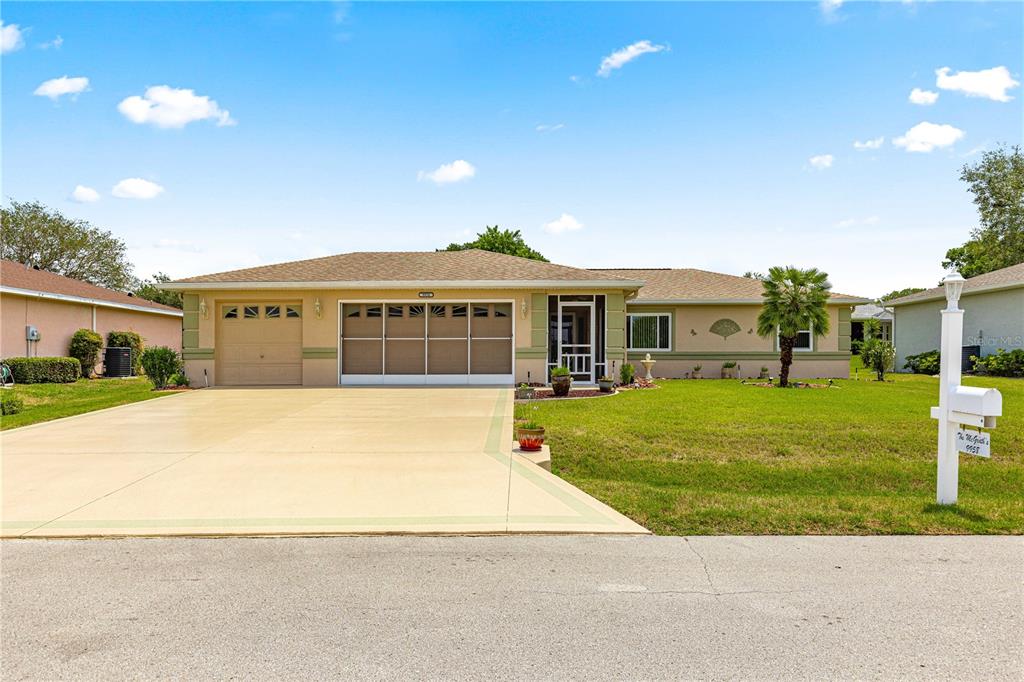 9958 Southwest 59th Circle Ocala, FL 34476 - Photo 37 of 45 a front view of a house with a yard