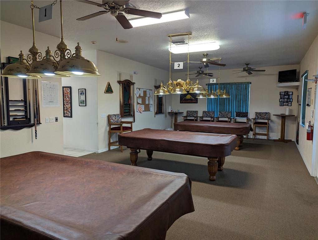 9958 Southwest 59th Circle Ocala, FL 34476 - Photo 40 of 45 a lobby with furniture and chandelier