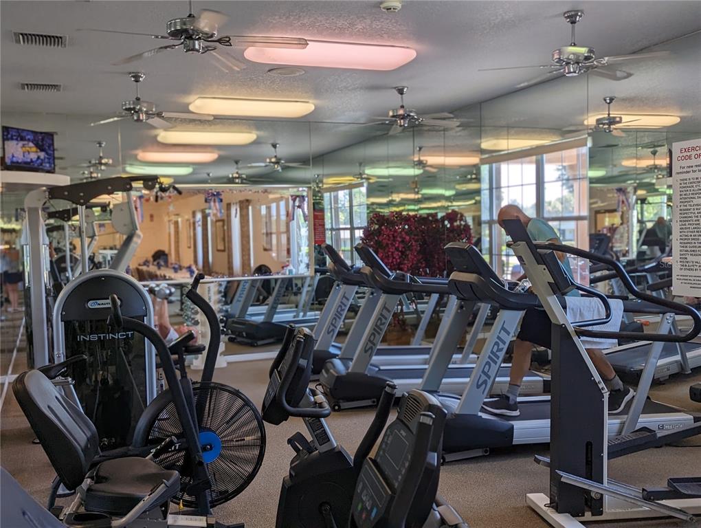9958 Southwest 59th Circle Ocala, FL 34476 - Photo 41 of 45 a view of a room with gym equipment