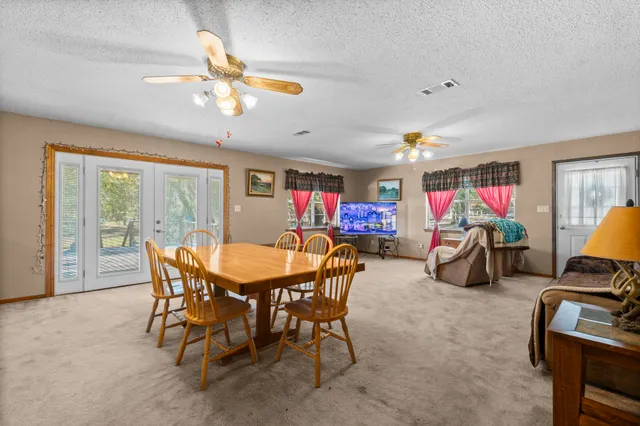 a kitchen with stainless steel appliances granite countertop a stove a sink dishwasher and a refrigerator