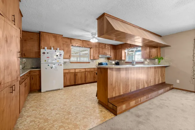 a kitchen with sink cabinets and window