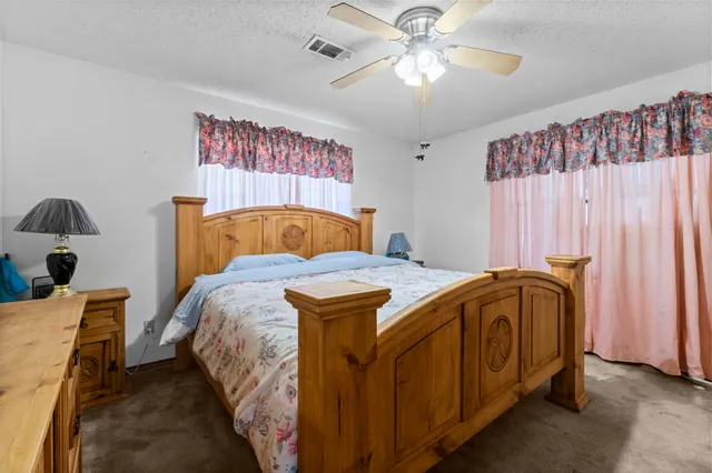 a bed room with a bed and a chandelier