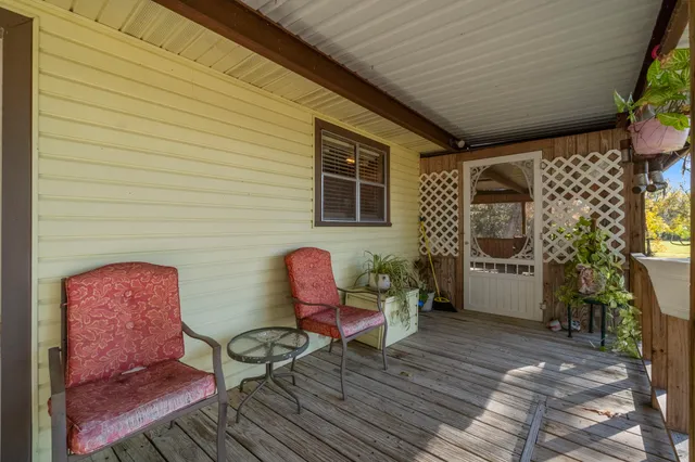 a view of room with wooden floor