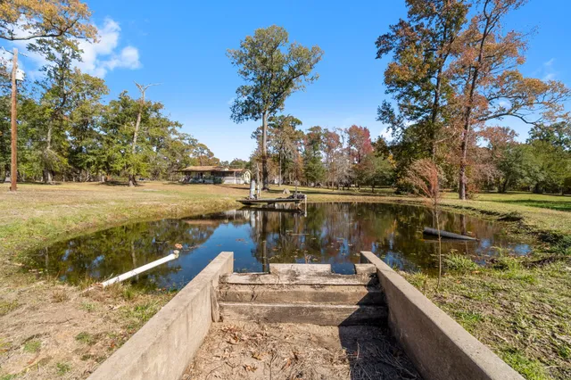 a house with a trees in the background