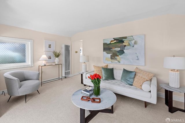 a living room with furniture and a couch