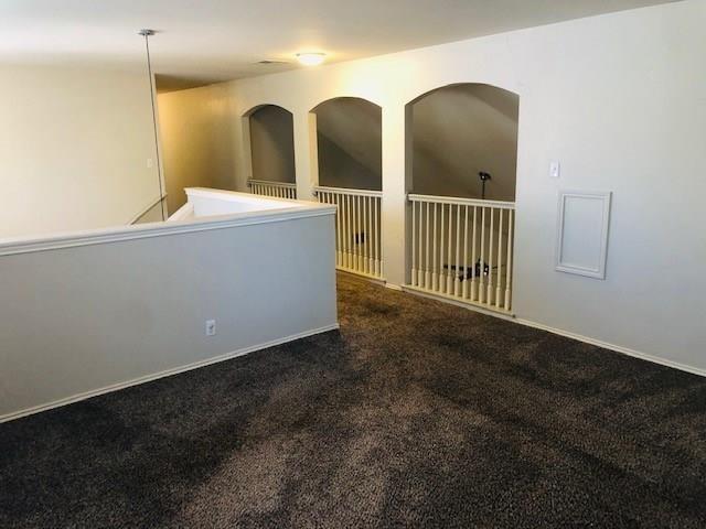1608 Tristan Way Cedar Park, TX 78613 - Photo 11 of 18 Spare room with dark colored carpet and baseboards