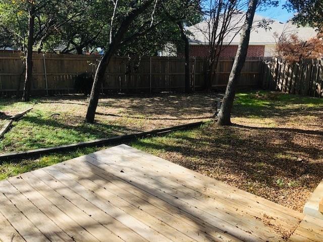 1608 Tristan Way Cedar Park, TX 78613 - Photo 16 of 18 Fenced backyard featuring a deck