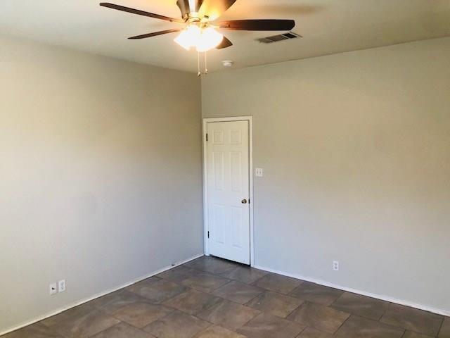 1608 Tristan Way Cedar Park, TX 78613 - Photo 6 of 18 Unfurnished room with stone finish floors and a ceiling fan