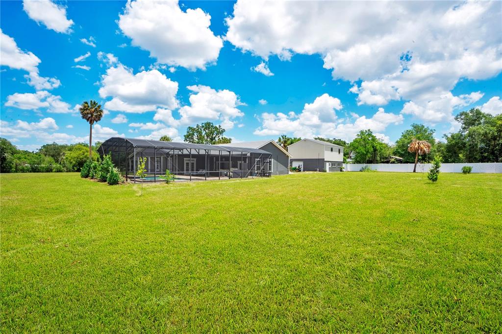 5785 Gilliam Road Orlando, FL 32818 - Photo 89 of 100 a view of a building with a big yard