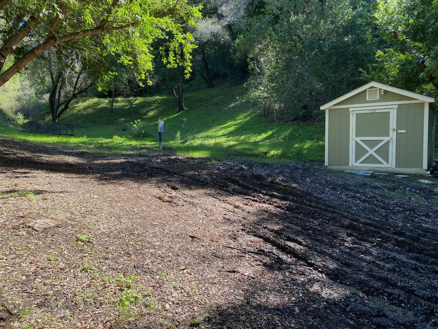 15397 Kennedy Road Los Gatos, CA 95032 - Photo 10 of 21 a front view of a house with a yard