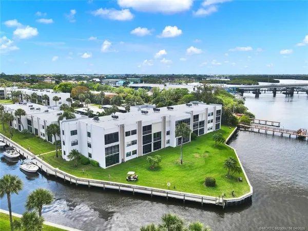 a view of a lake with houses in the back