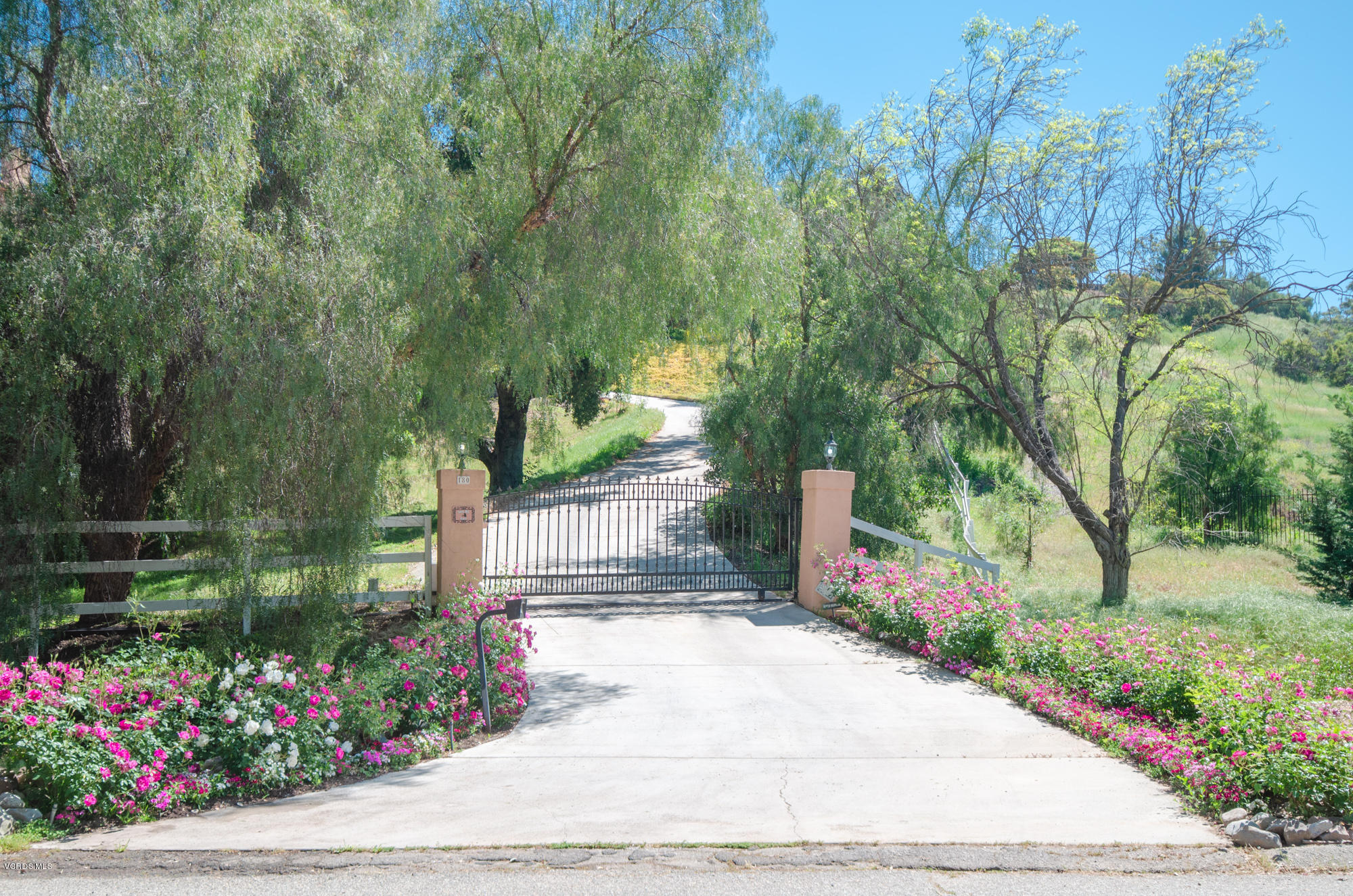 180 Sundown Road Thousand Oaks, CA 91361 - Photo 2 of 32 a view of a garden with flowers and trees