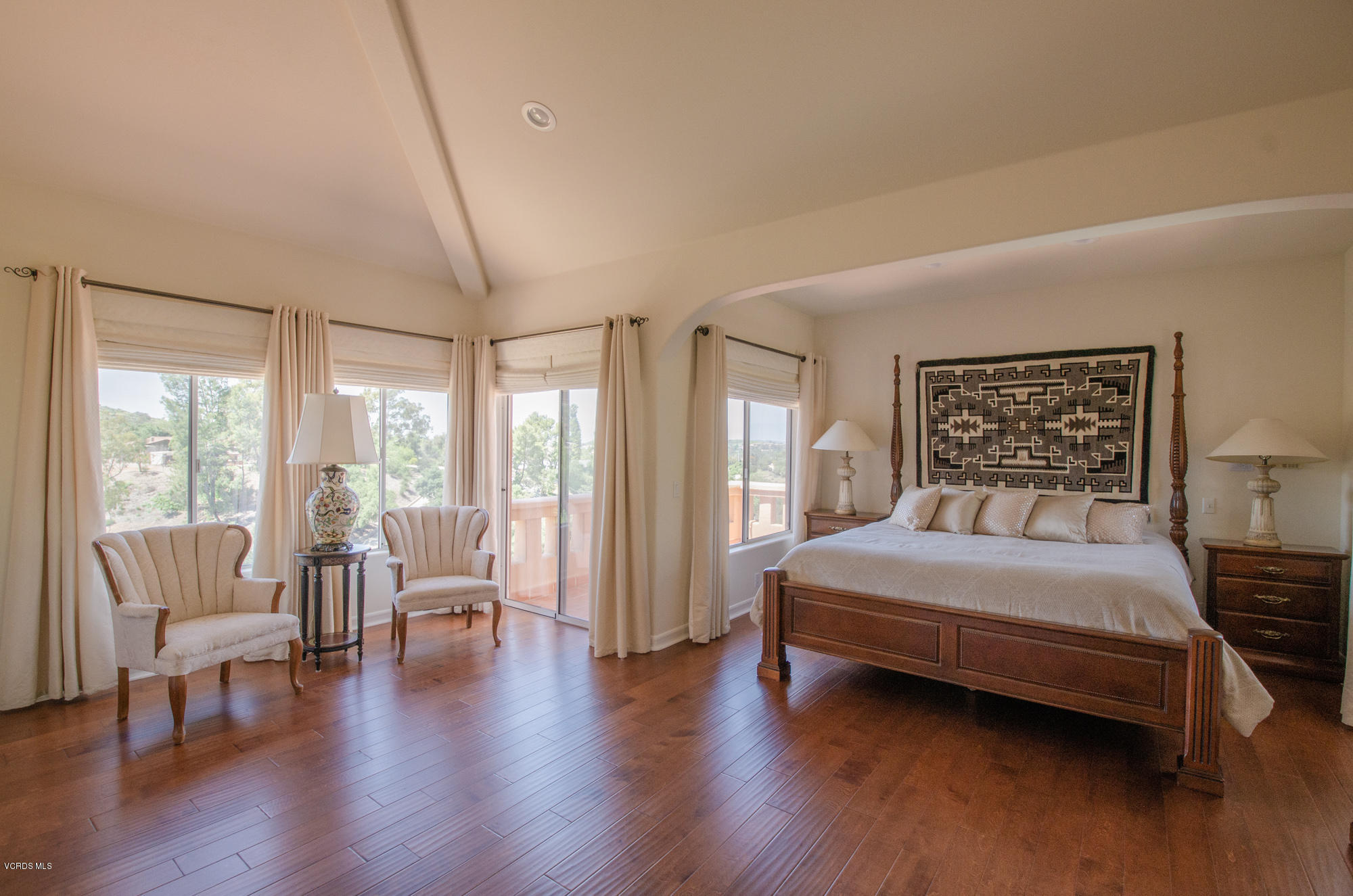 180 Sundown Road Thousand Oaks, CA 91361 - Photo 14 of 32 a bedroom with a large bed and a large window