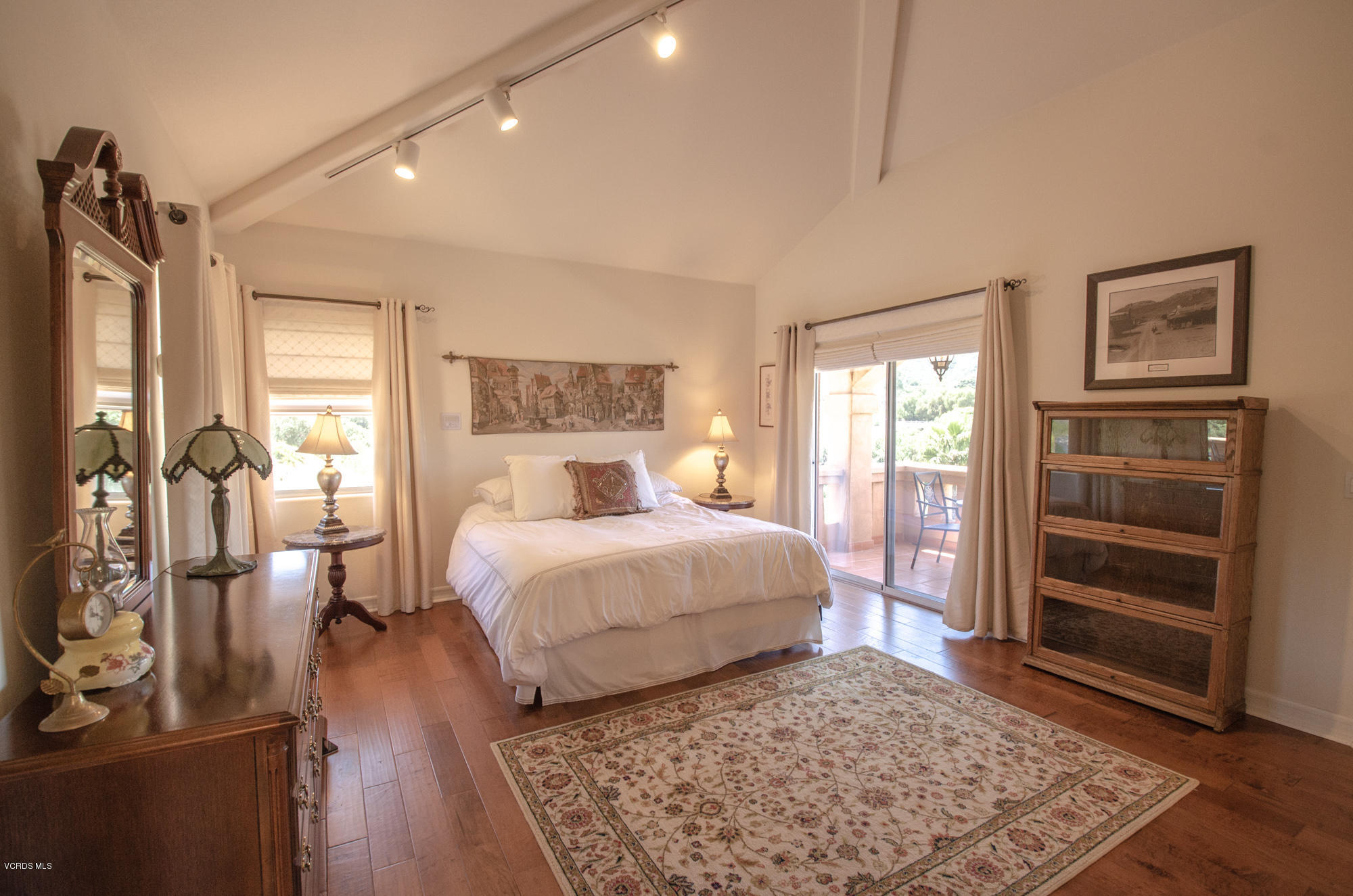 180 Sundown Road Thousand Oaks, CA 91361 - Photo 16 of 32 a bedroom with a bed and wooden floor