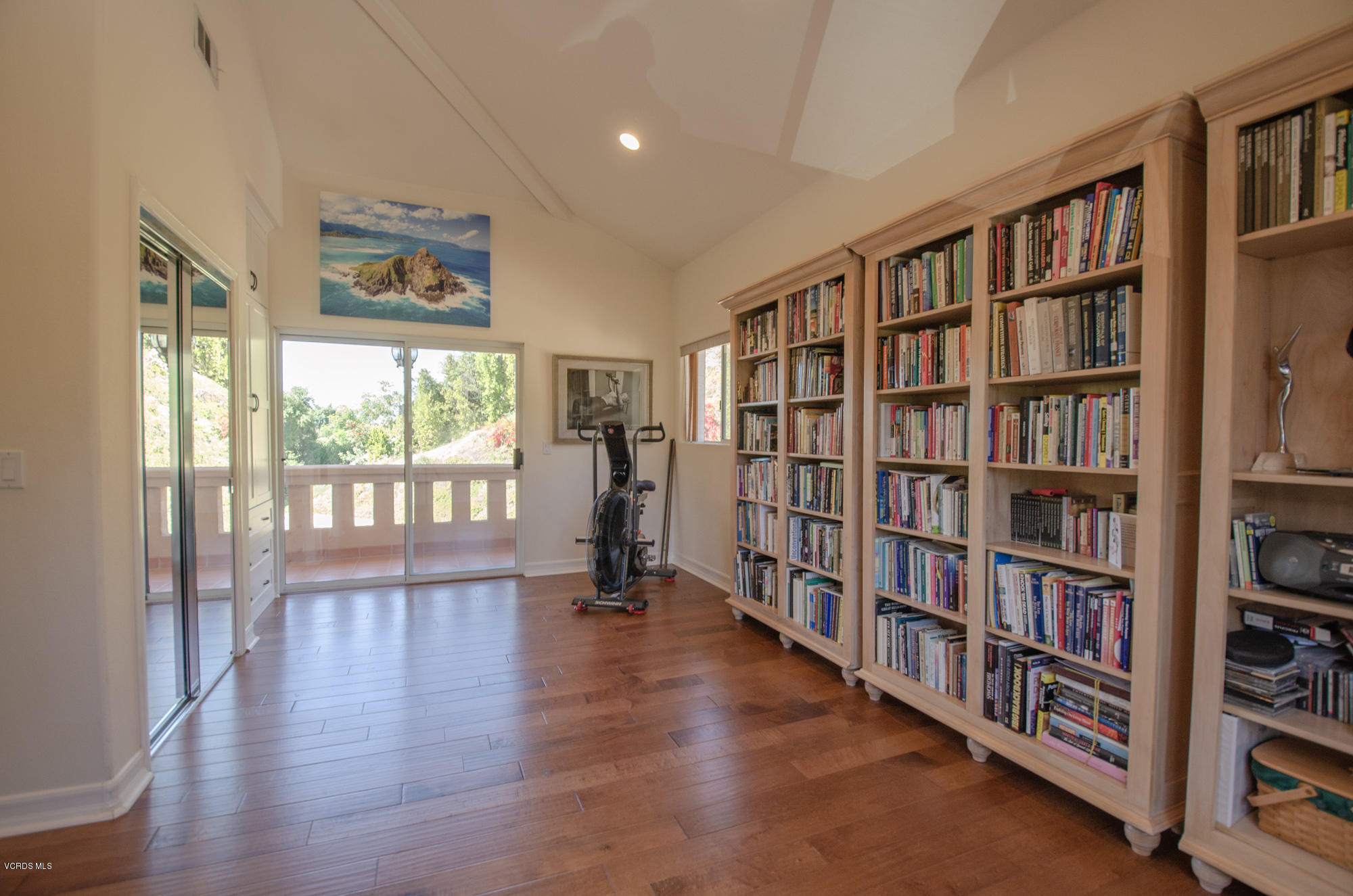 180 Sundown Road Thousand Oaks, CA 91361 - Photo 18 of 32 a view of an empty room with window and wooden floor