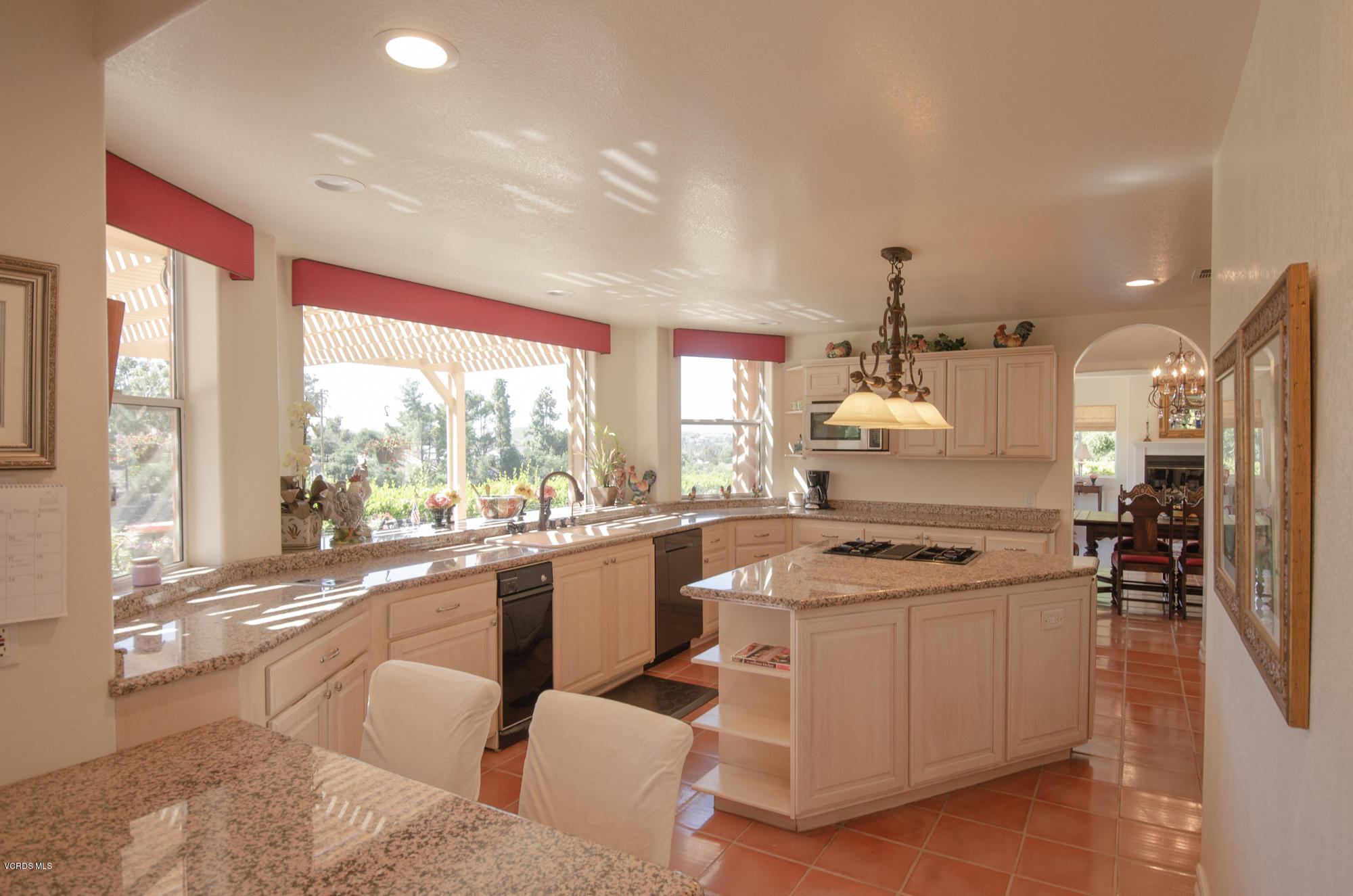 180 Sundown Road Thousand Oaks, CA 91361 - Photo 10 of 32 a kitchen with stainless steel appliances granite countertop a stove and a refrigerator