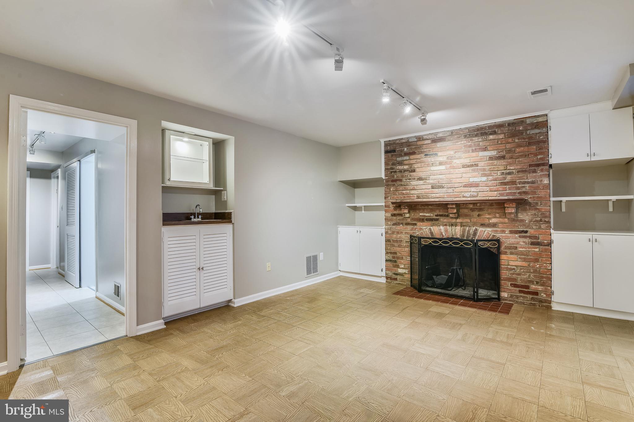 6819 Melrose Drive McLean, VA 22101 - Photo 28 of 45 Built in wet-bar and shelving