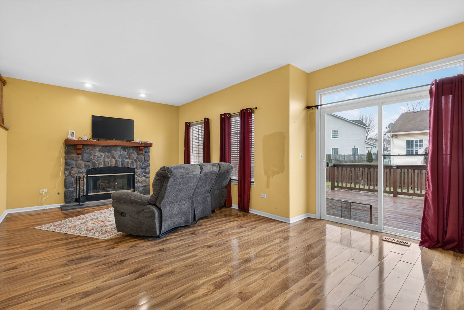 1451 Red Top Lane Minooka, IL 60447 - Photo 13 of 37 a living room with furniture and a fireplace