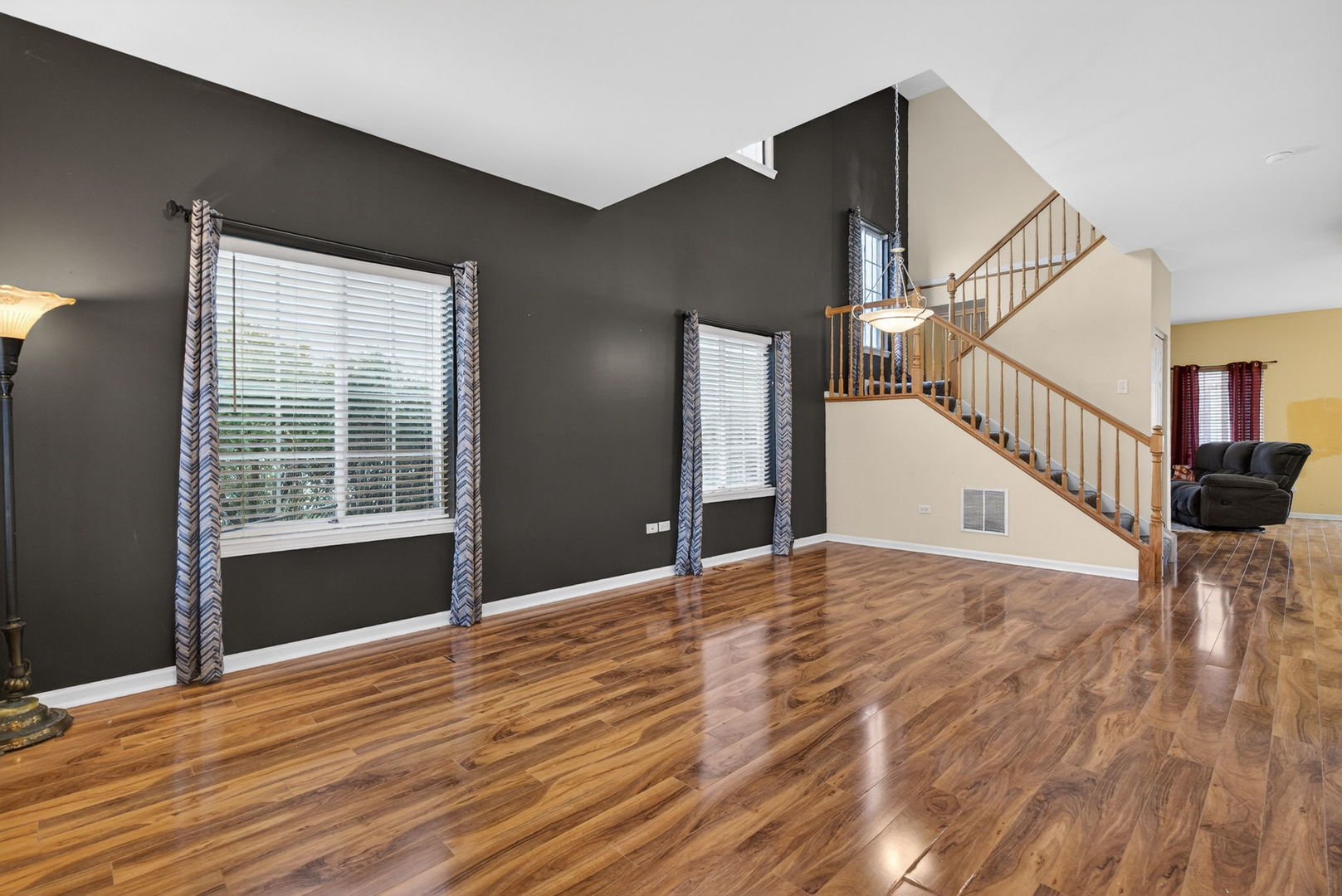 1451 Red Top Lane Minooka, IL 60447 - Photo 2 of 37 a view of an empty room with wooden floor and a window