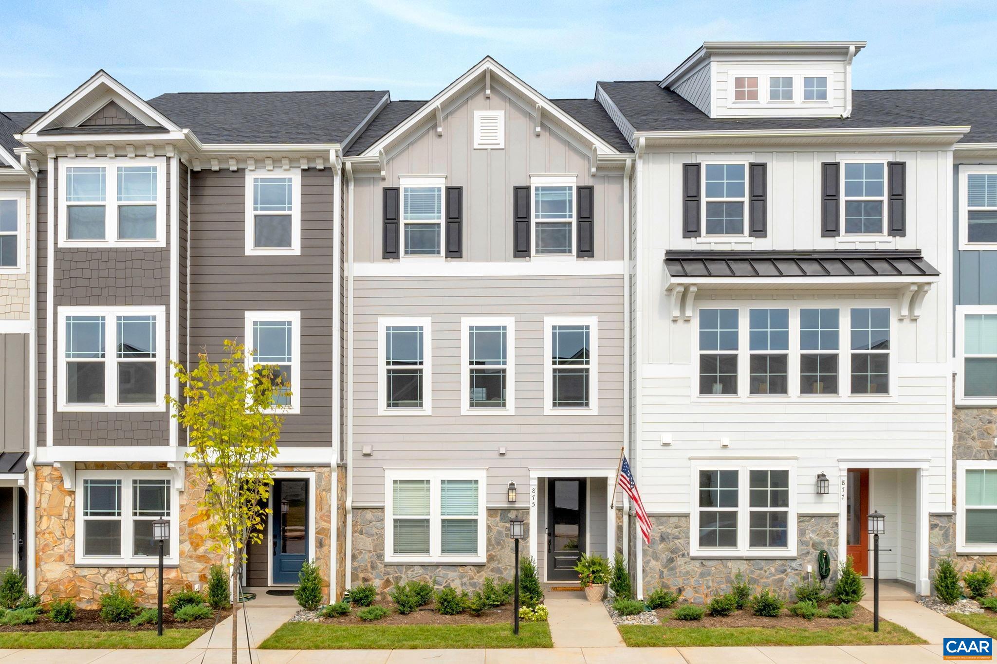 2269 Woodburn Road Charlottesville, VA 22901 - Photo 1 of 39 a front view of a residential apartment building with a yard