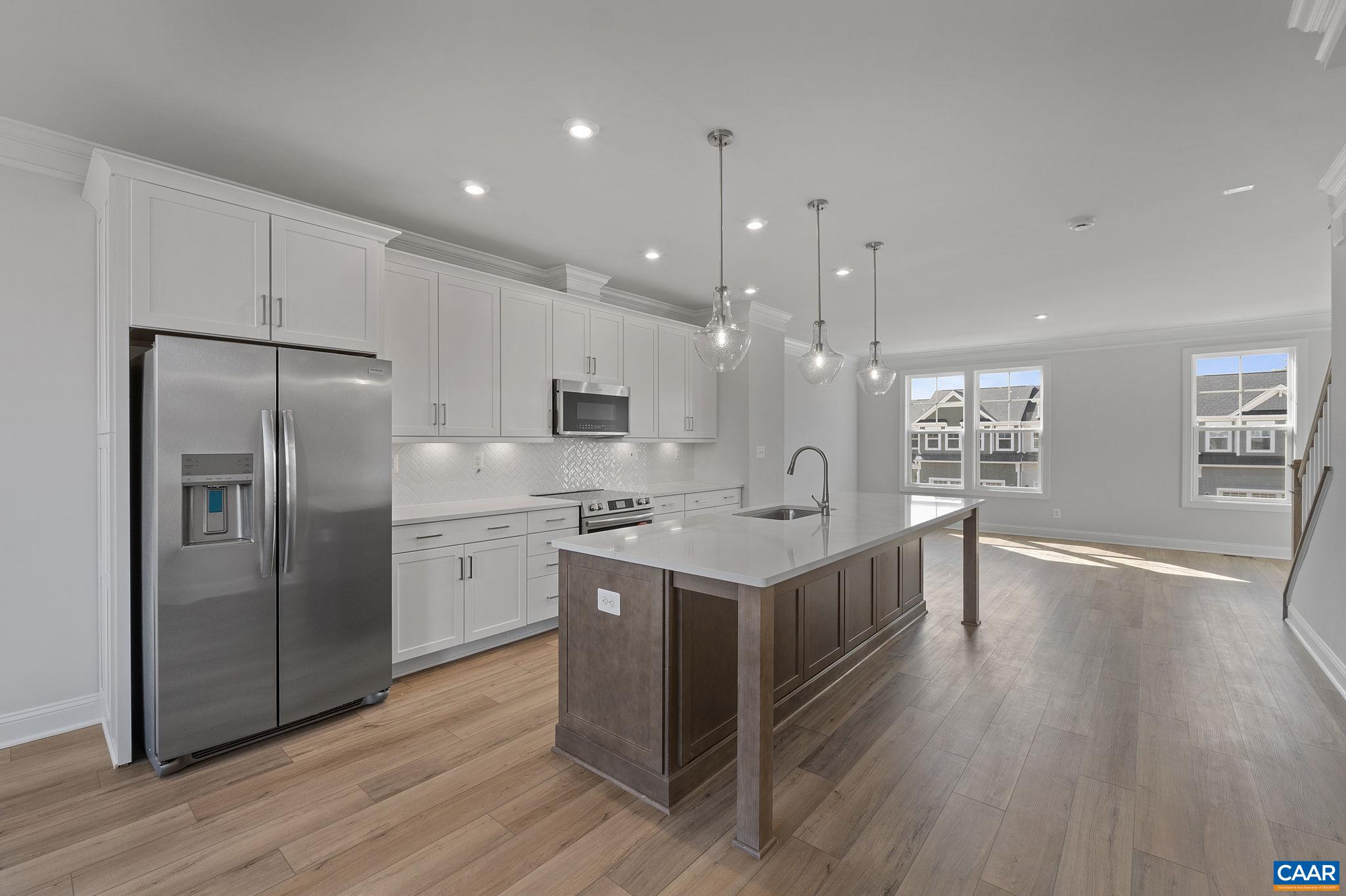 2269 Woodburn Road Charlottesville, VA 22901 - Photo 12 of 39 a kitchen with stainless steel appliances a sink cabinets and wooden floor