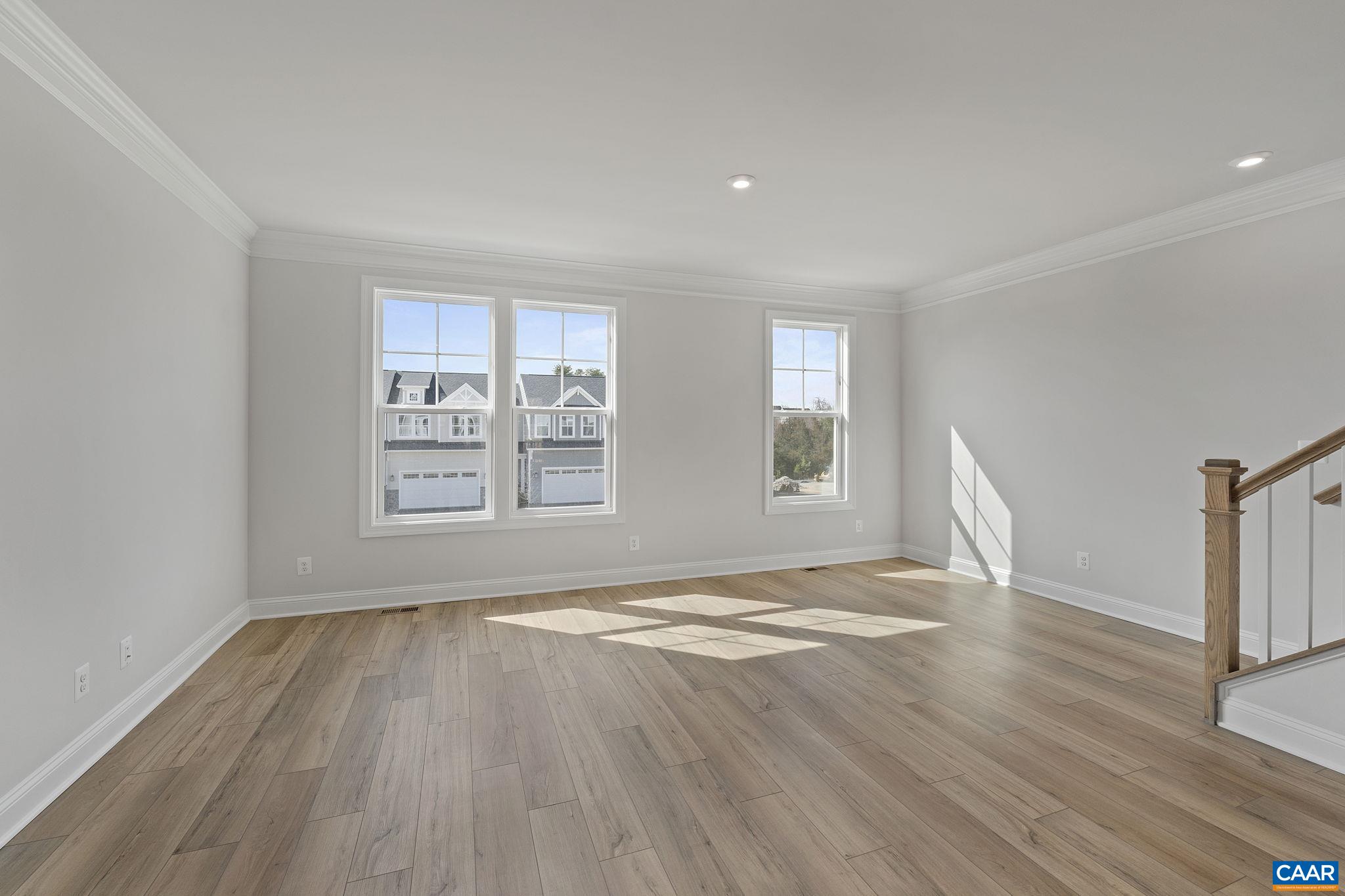 2269 Woodburn Road Charlottesville, VA 22901 - Photo 16 of 39 a view of empty room with wooden floor and fan