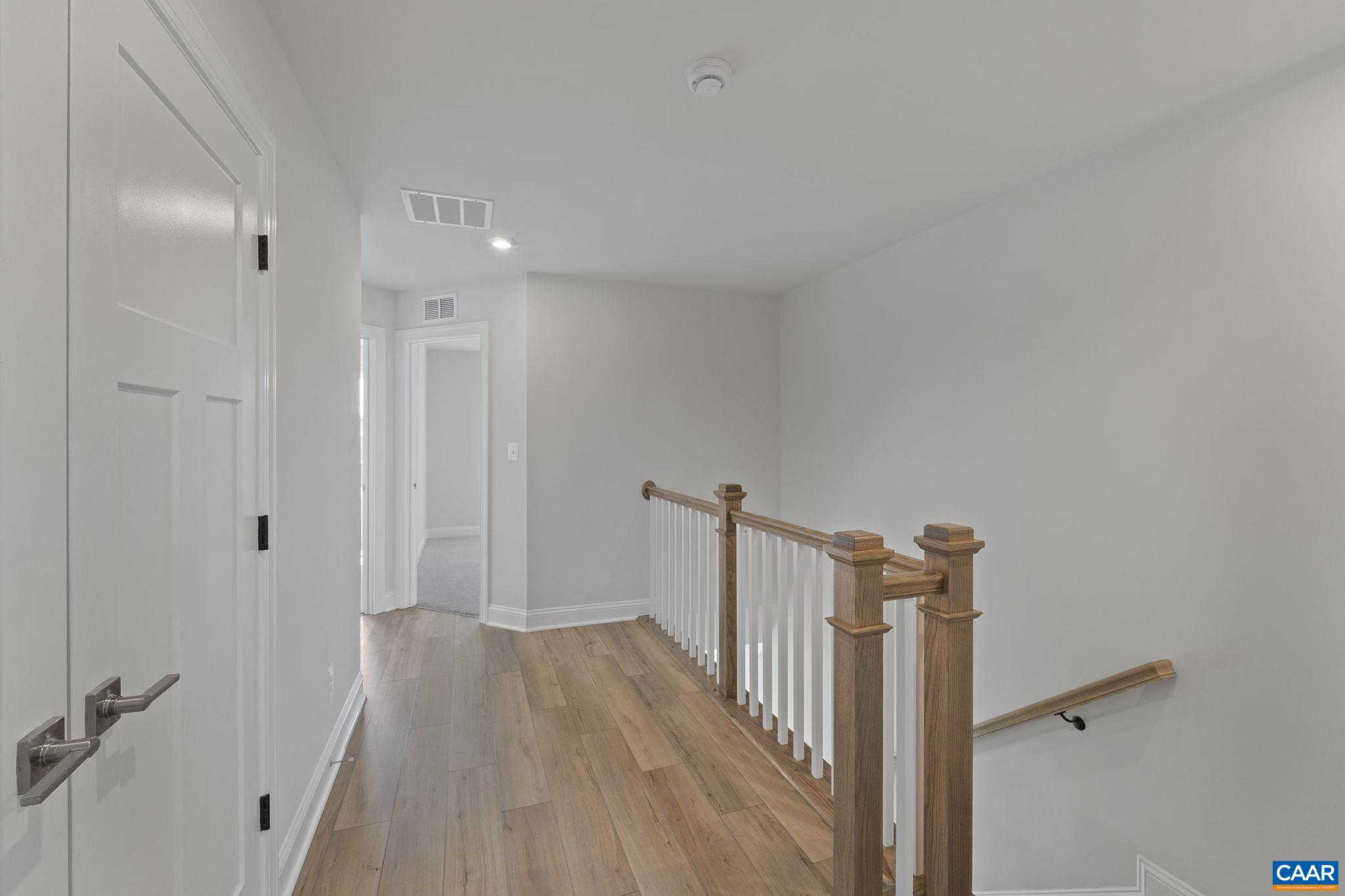 2269 Woodburn Road Charlottesville, VA 22901 - Photo 25 of 39 a view of a hallway with a wooden floor