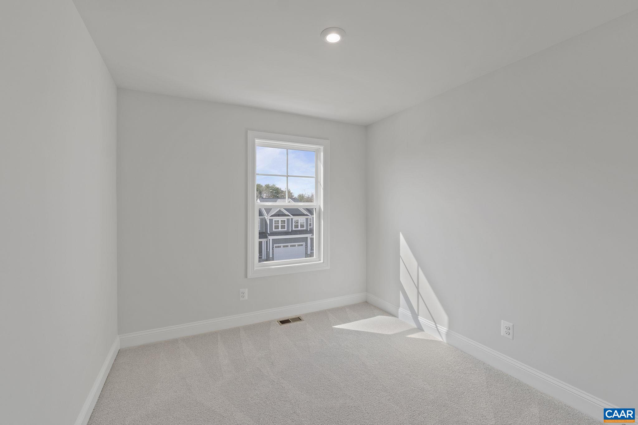2269 Woodburn Road Charlottesville, VA 22901 - Photo 29 of 39 an empty room with windows