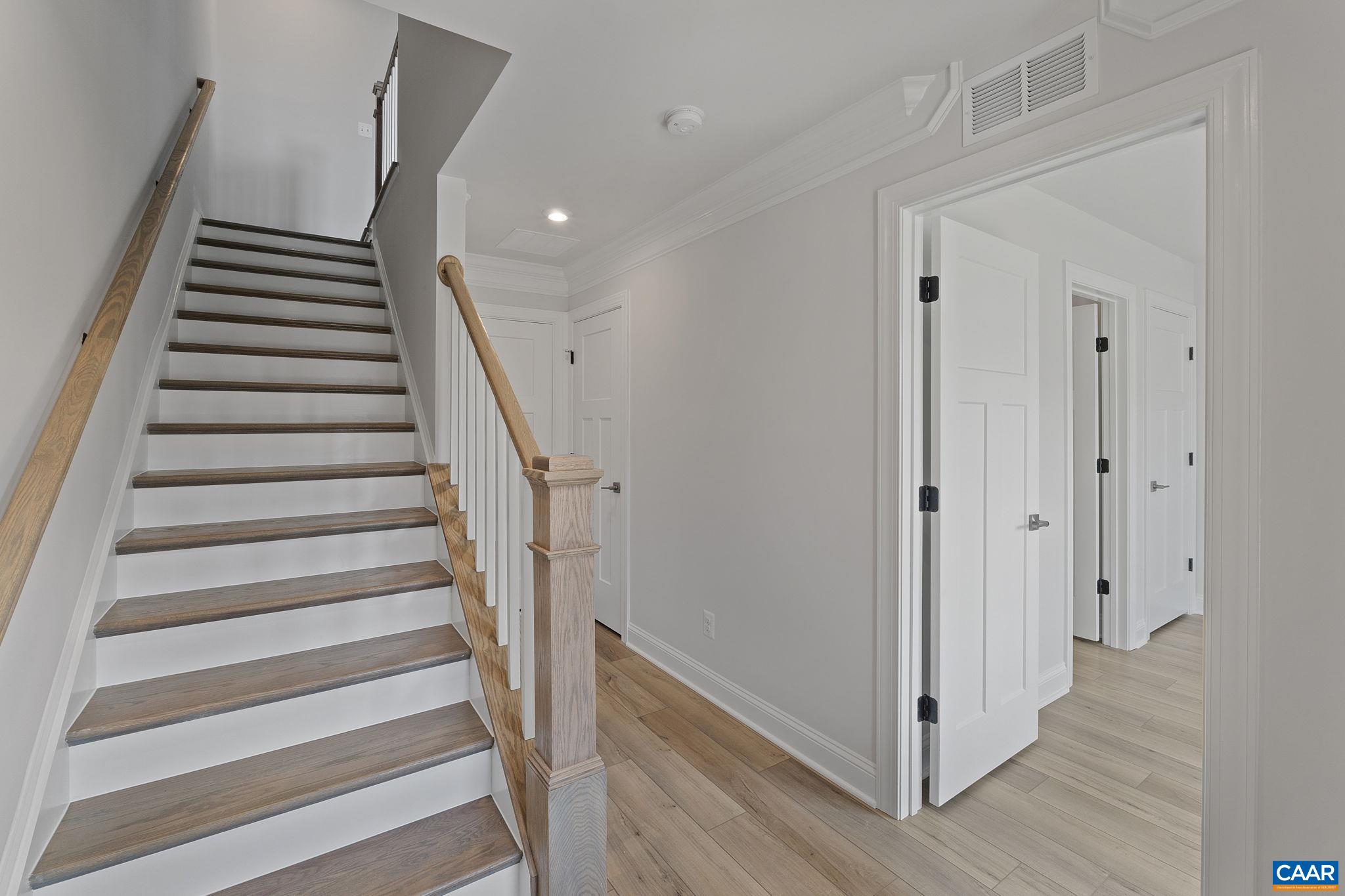 2269 Woodburn Road Charlottesville, VA 22901 - Photo 3 of 39 a view of entryway with wooden floor and stairs