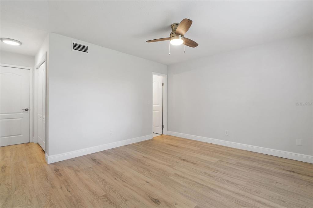 5207 Burr Place Seffner, FL 33584 - Photo 16 of 34 wooden floor in an empty room