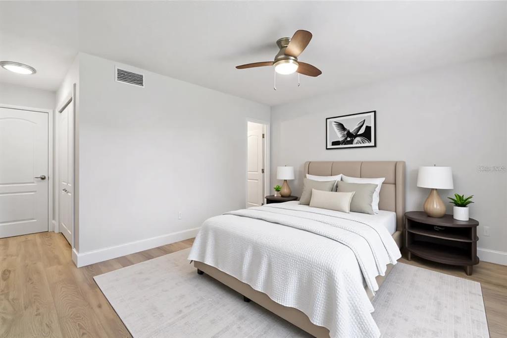 5207 Burr Place Seffner, FL 33584 - Photo 17 of 43 a bedroom with a bed and a painting on the wall