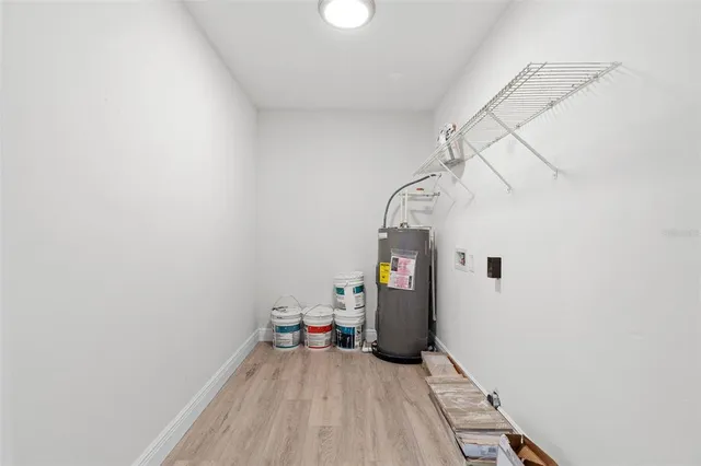 a view of wooden floor and windows in a room