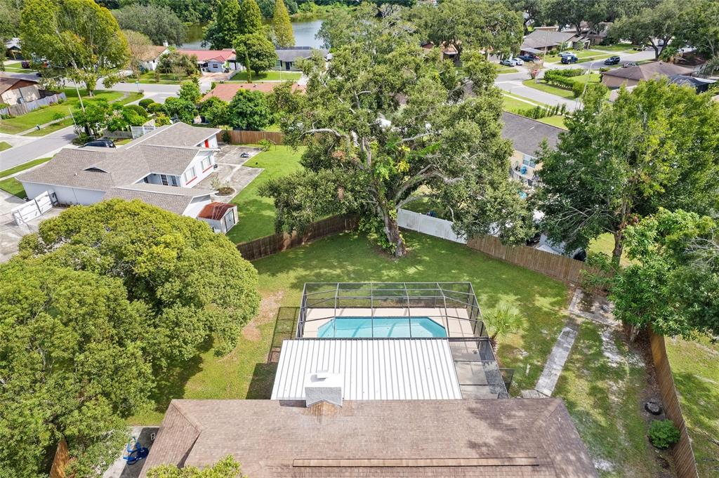 5207 Burr Place Seffner, FL 33584 - Photo 30 of 34 an aerial view of residential houses with outdoor space and trees