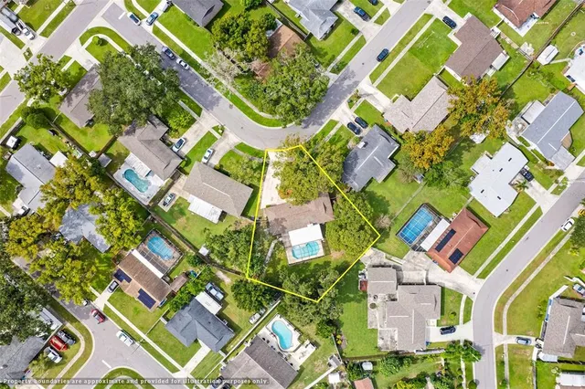 an aerial view of a residential apartment building with a yard