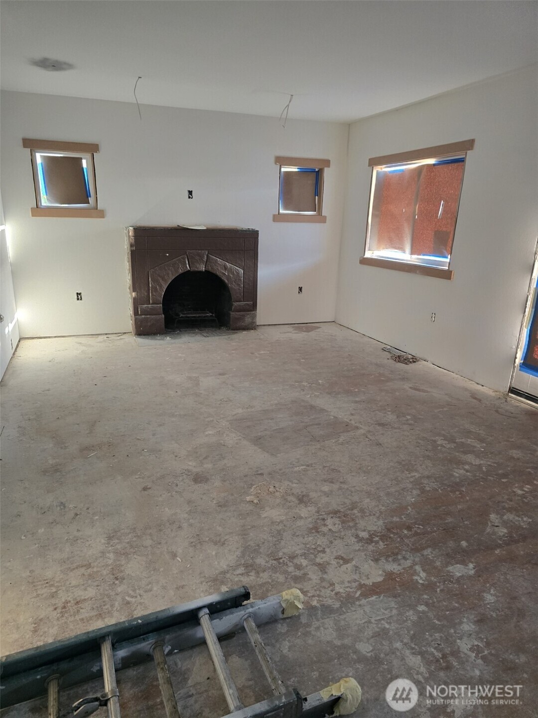 1501 Broadway Everett, WA 98201 - Photo 7 of 9 a view of empty room with a fireplace