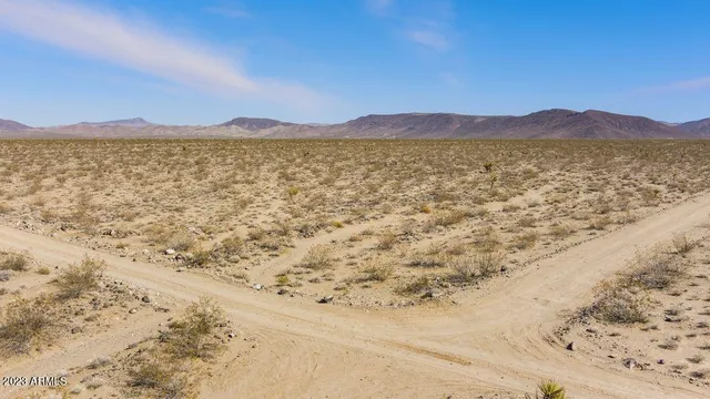 a view of an ocean beach and mountain