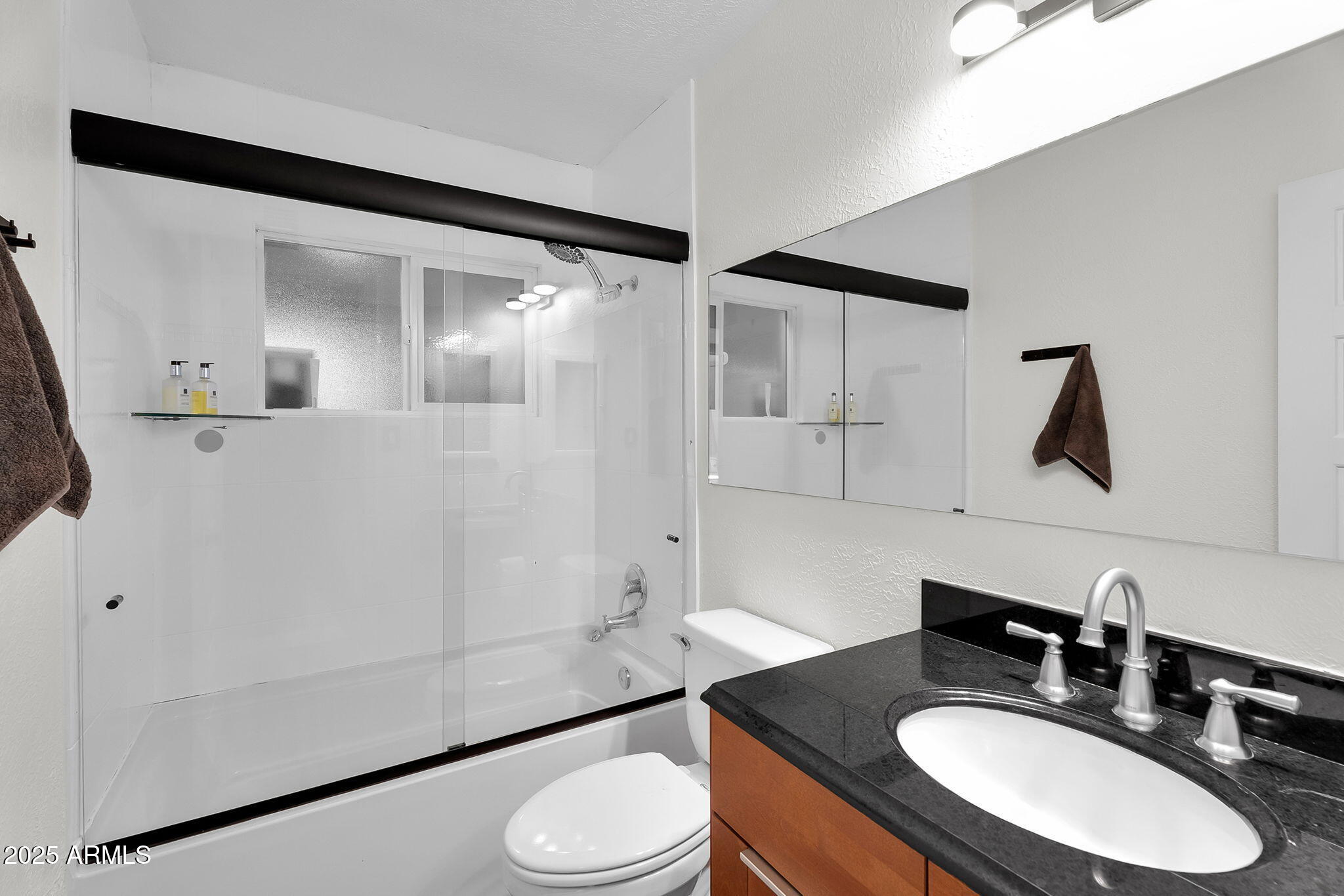 1035 East Pierson Street Phoenix, AZ 85014 - Photo 10 of 34 a bathroom with a sink a toilet and shower
