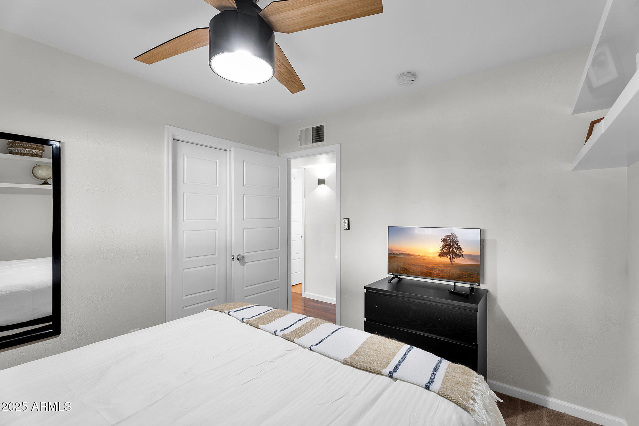 1035 East Pierson Street Phoenix, AZ 85014 - Photo 11 of 34 a bedroom with a bed and a tv