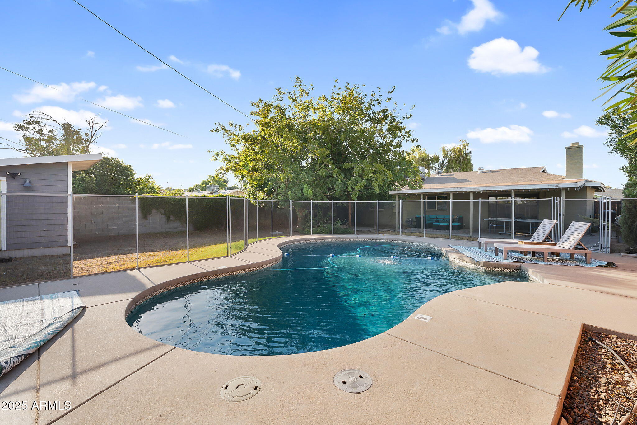 1035 East Pierson Street Phoenix, AZ 85014 - Photo 16 of 34 a view of a swimming pool with a patio