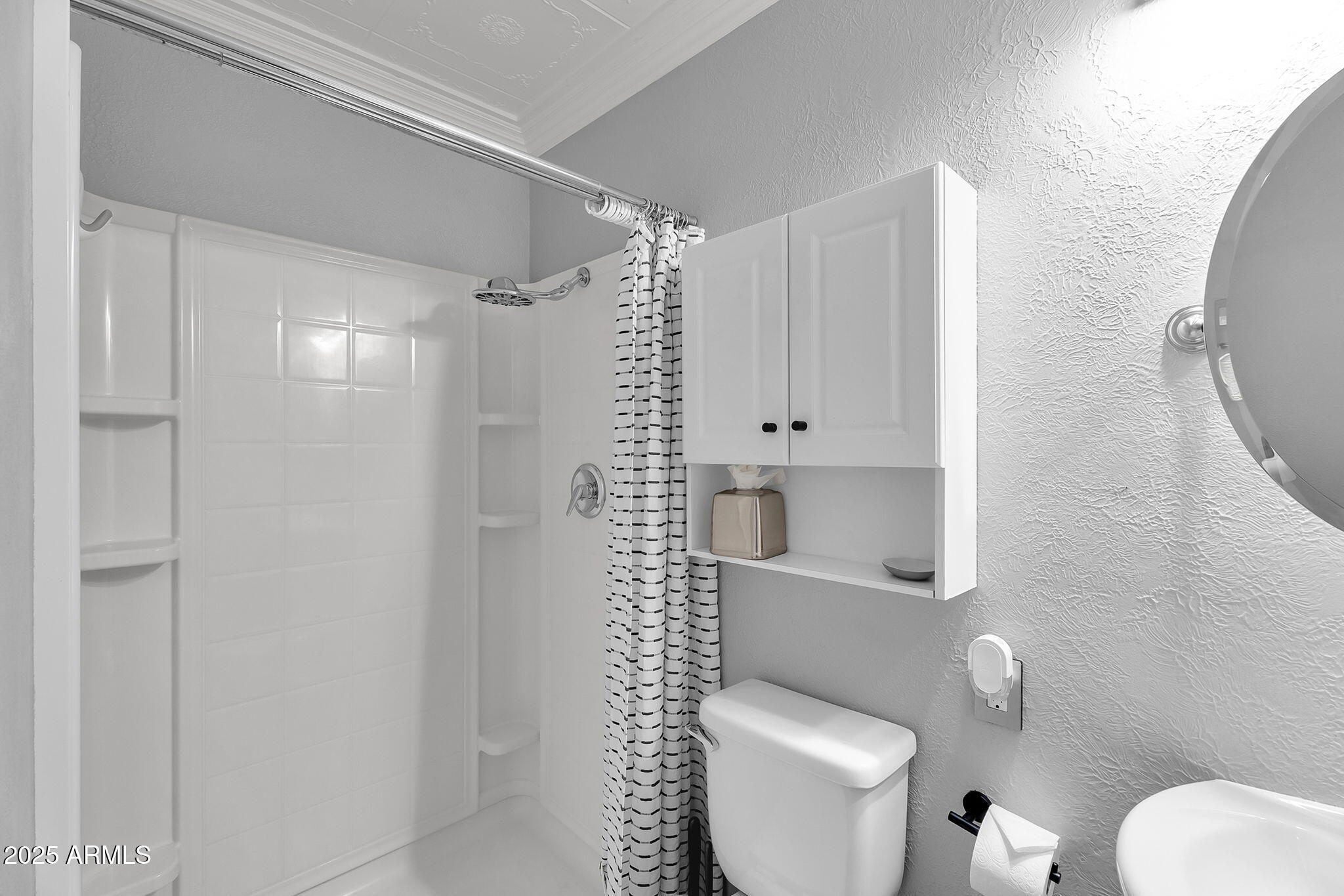 1035 East Pierson Street Phoenix, AZ 85014 - Photo 19 of 34 a bathroom with a toilet sink and shower