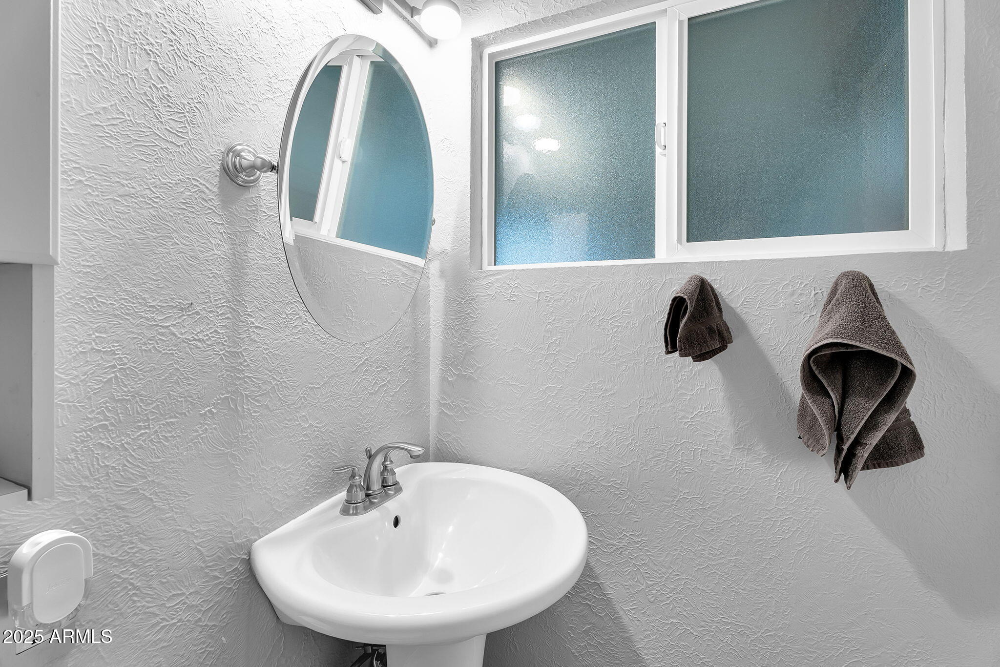 1035 East Pierson Street Phoenix, AZ 85014 - Photo 20 of 34 a bathroom with a sink and mirror