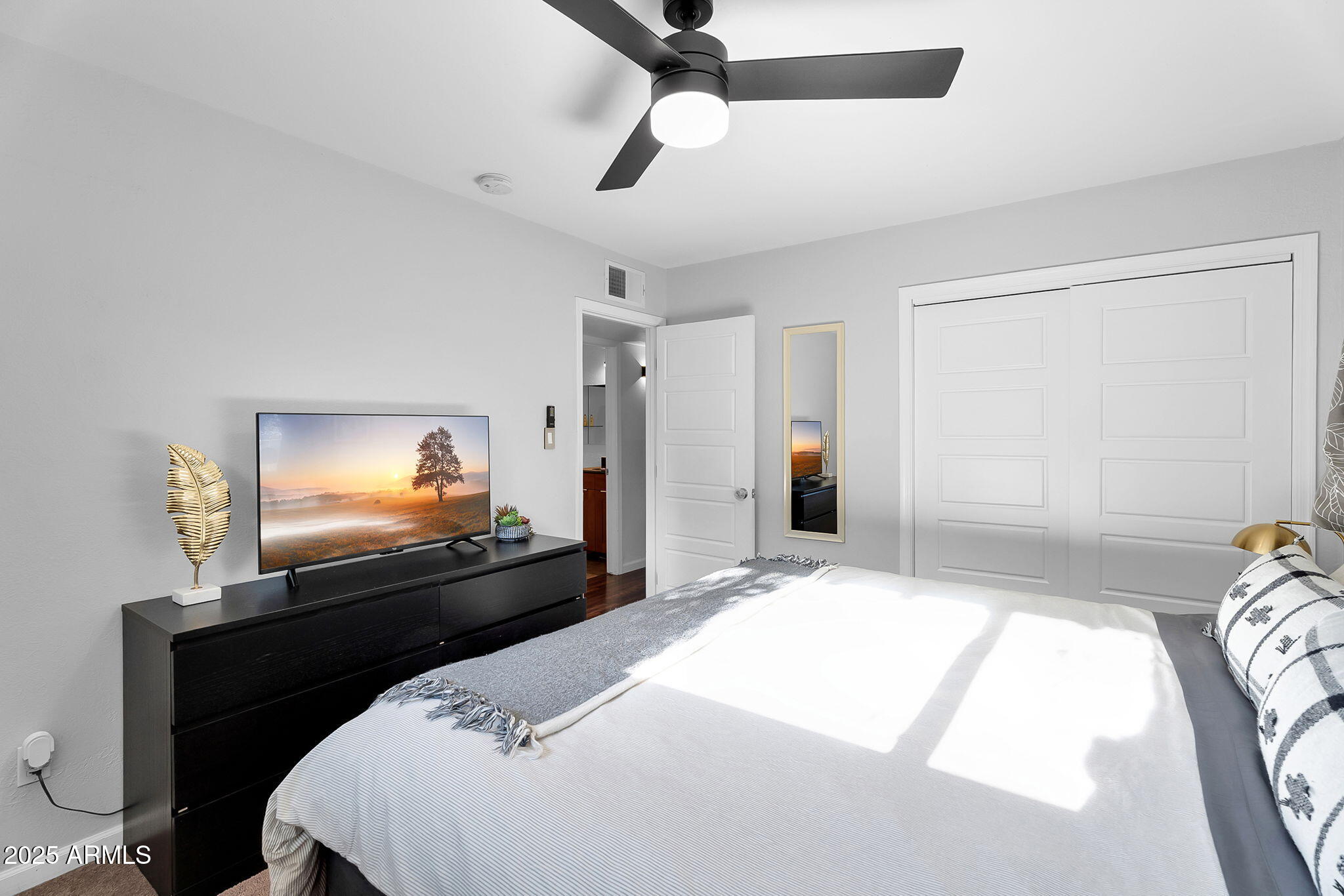1035 East Pierson Street Phoenix, AZ 85014 - Photo 22 of 34 a bedroom with a bed and a flat screen tv