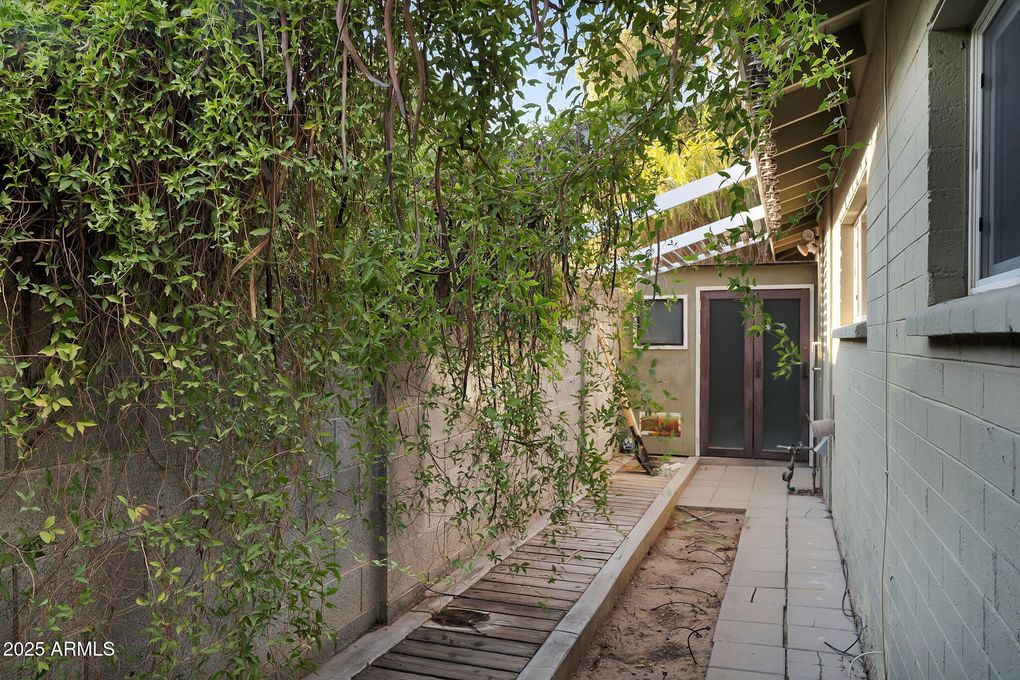 1035 East Pierson Street Phoenix, AZ 85014 - Photo 23 of 34 a view of a pathway both side of house