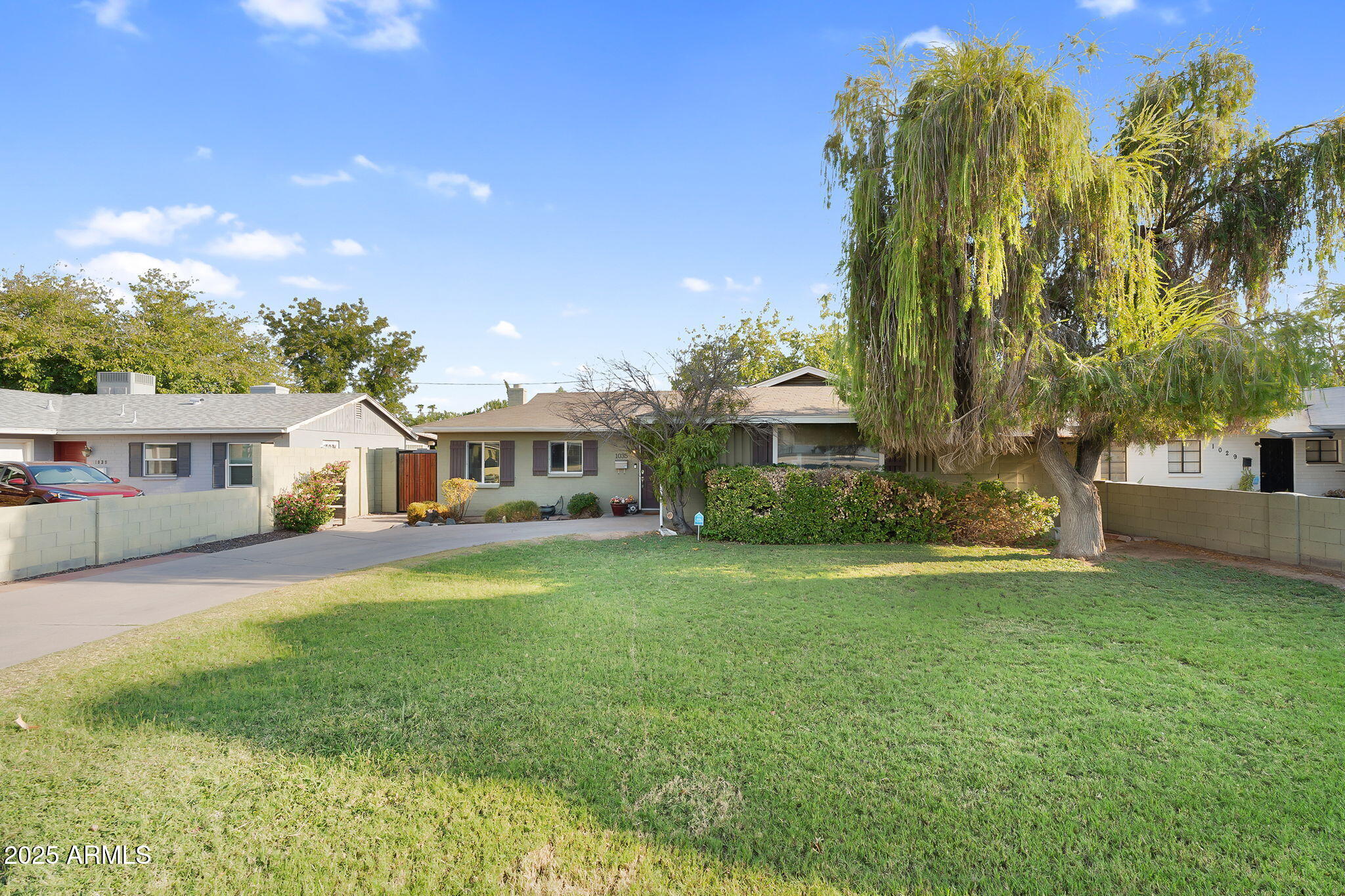 1035 East Pierson Street Phoenix, AZ 85014 - Photo 33 of 34 a front view of a house with a garden and trees