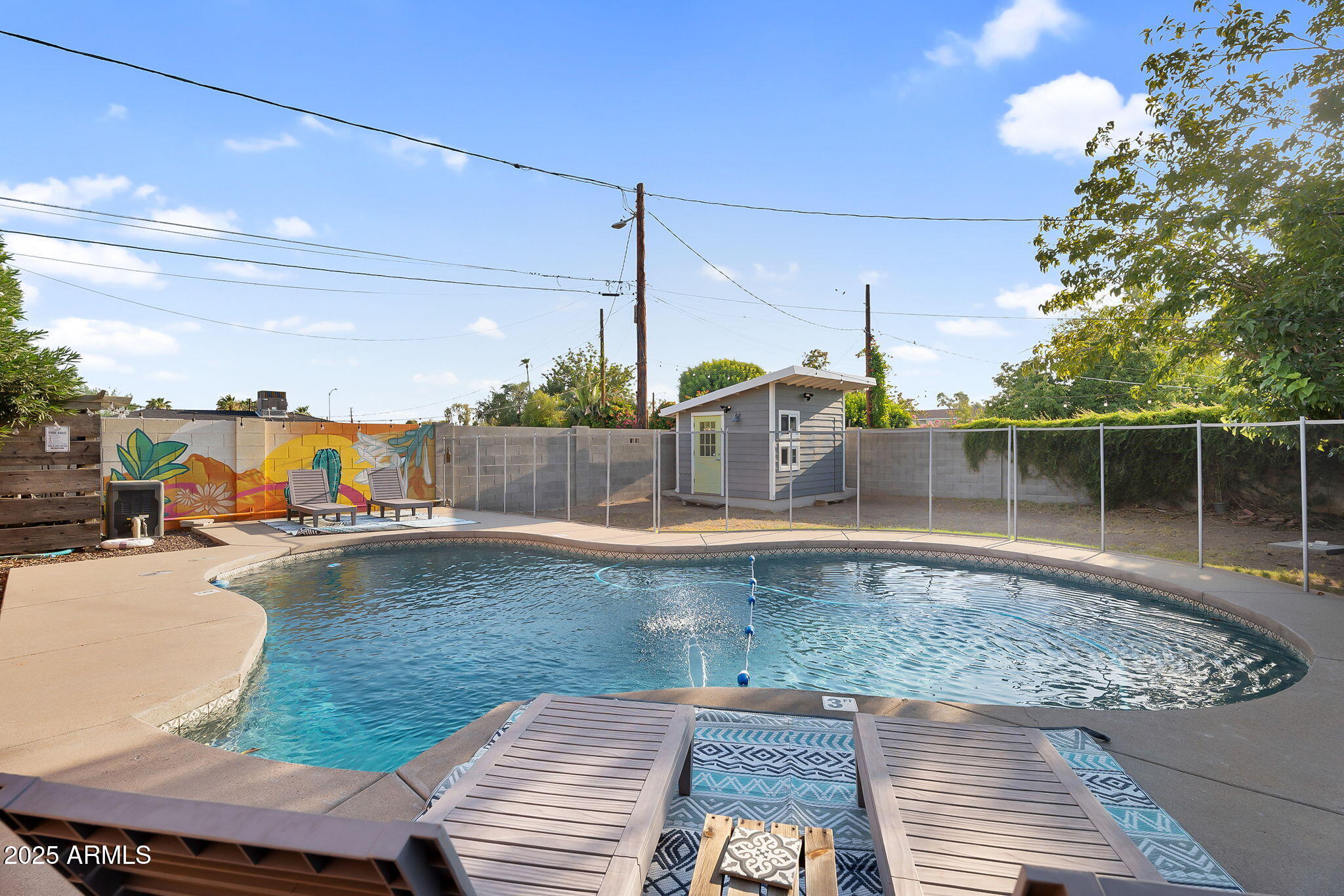 1035 East Pierson Street Phoenix, AZ 85014 - Photo 5 of 34 a view of a swimming pool with a lounge chairs