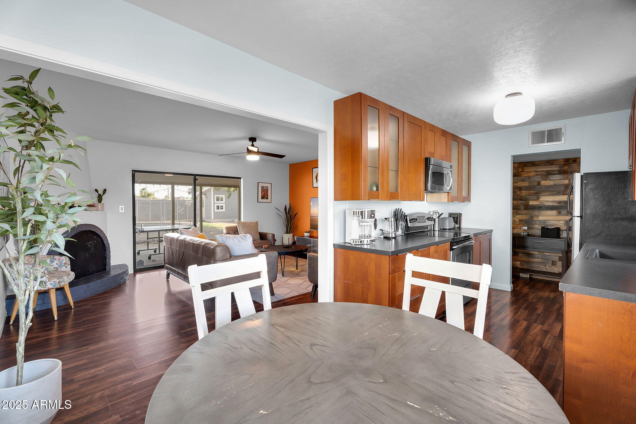 1035 East Pierson Street Phoenix, AZ 85014 - Photo 6 of 34 a living room with fireplace furniture and a wooden floor