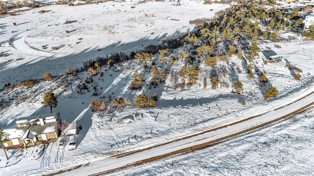 a view of wooden floor with a bench