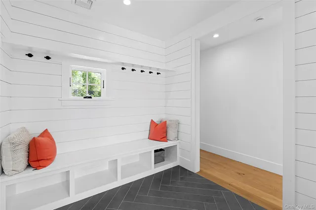 a kitchen with white cabinets and sink