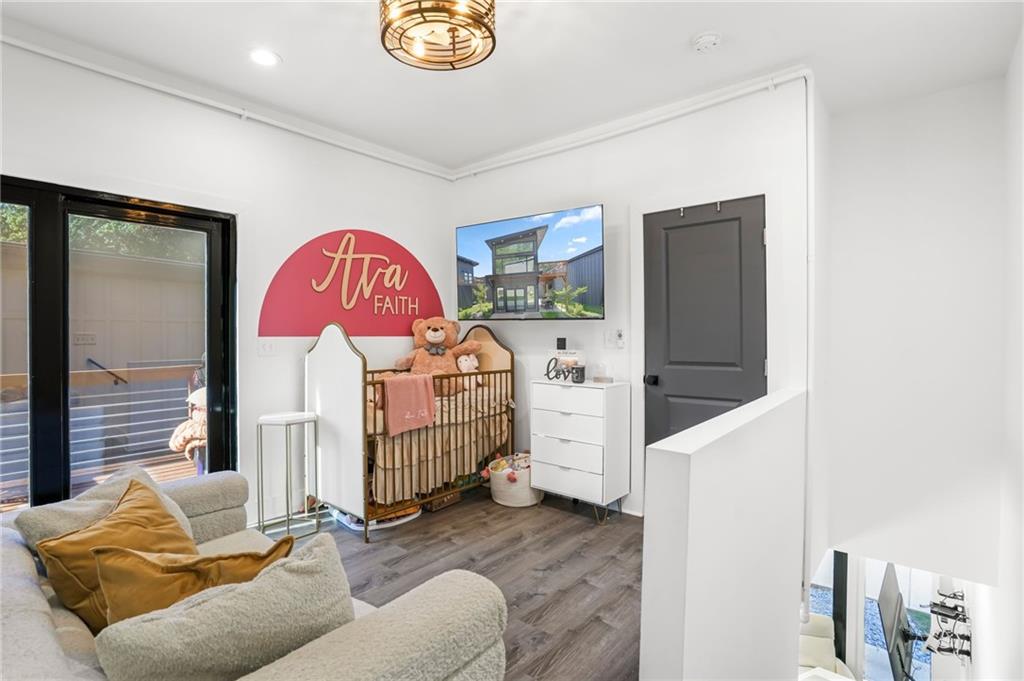 3120 Godby Road, Unit 1107 Atlanta, GA 30349 - Photo 14 of 29 a bedroom with furniture and natural light